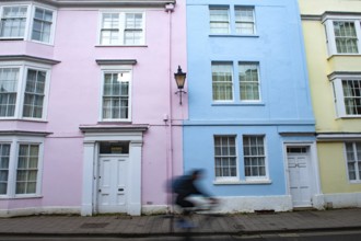Oxford, England, UK. February 2nd, 2020 An Oxford university student cycles along Hollywell Street,