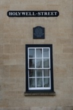 Oxford, England, UK. February 2nd, 2020 A window and plaque on Hollywell Street in the University