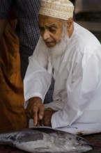 Muscat, Oman. May 26th 2014 Buying and selling inside Muscat Fish Market, Oman