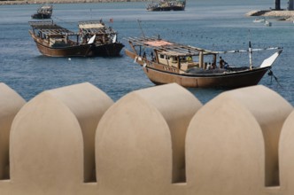 Traditional Omani Dhows anchored in the historic harbor of Sur on the Gulf of Oman