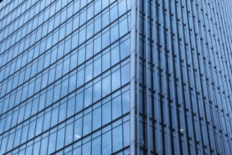 Modern abstract reflections in glass fronted commercial office buildings in the financial district