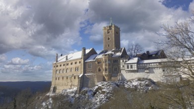 Wartburg in Eisenach, under partly cloudy winter skies, hiking on the Rennsteig, Thuringian Forest