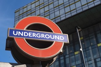 London, United Kingdom. October 10th 2023 Iconic British Underground Tube Sign against modern