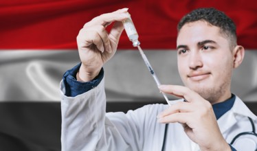 Doctor holding syringe on Yemen flag background. Medical professional holding syringe with Yemeni