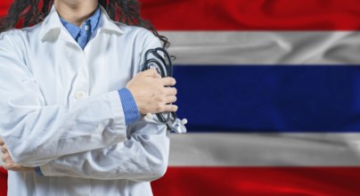 Healthcare professional with Thailand flag background. Professional doctor holding stethoscope on