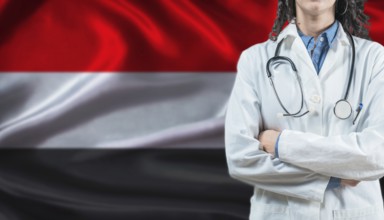 Medical professional on Yemen flag. Healthcare and wellness in Yemen, Concept