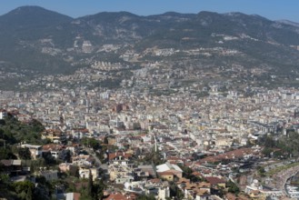 Aerial landscape view of houses and property in Alanya city set on the slopes the Taurus Mountains