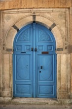 Detailed blue ornate design of a typical door in the Medina of Tunis, a UNESCO designated quarter