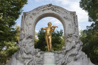 Vienna, Austria. October 5th 2023 The golden statue of Johann Strauss Jr in the Stadtpark, part of