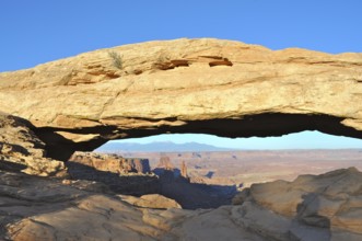Impressive Mesa Arch rock arch over the vast desert landscape, Canyonlands National Park, Island in