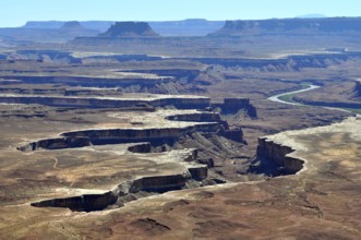 Sublime canyon landscape with river, formed by erosion, under clear sky, Canyonlands National Park,