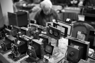 Dealer, Photographica, old photo equipment, cameras, lenses, display, black and white, photo