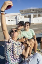A heartwarming family moment as a teenager with Down Syndrome poses for a selfie with loved ones