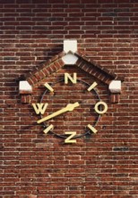 Wind clock on brick wall, Roermond, Limburg Province, Netherlands