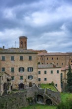 A charming view of Volterra, Tuscany, featuring traditional stone houses and rustic architecture.