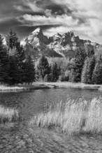 Dramatic black and white photograph capturing the rugged beauty of Grand Teton National Park,