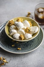 Homemade vanilla mini zephyr-marshmallows filled with rose jam, paired with a refreshing coffee