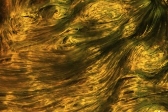 The dynamic colors and abstract swirls in the Riotinto River, Huelva, Spain, create a vivid display