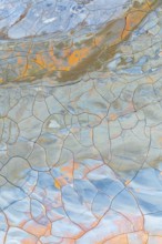Multicolor cracked mud texture showcasing vibrant patterns and natural hues Abstract art created by