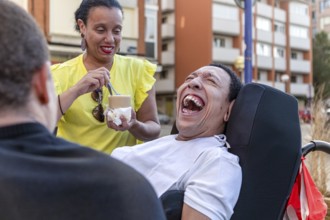 Mixed-race Spanish Cameroonian siblings share a joyful moment outside. One of the siblings, living