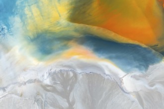 A vibrant abstract texture featuring a blend of multicolor swirls and organic patterns Rich blues,