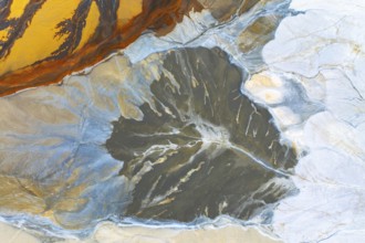 A stunning aerial view showcasing fluid multicolored abstract textures, resembling vibrant