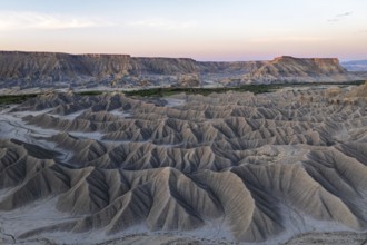A stunning view of the rugged formations of Caineville Mesa in Utah during sunrise The intricate