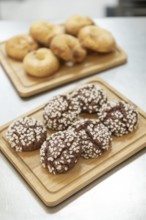 A charming Italian bakery setting with freshly baked cookies topped with sugar crystals and golden