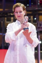 Sandra Hüller poses with the Silver Bear for the best acting performance in a leading role in the