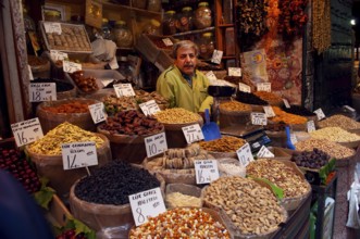 Istanbul, Turkey. May 20th 2010 A Turkish stall holder selling dried fruit and nuts inside the