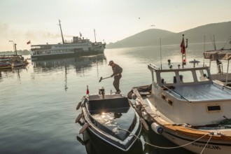 Istanbul, Turkey. 13th April 2016 Cleaning boat decks in the beautiful morning light on Burgazada