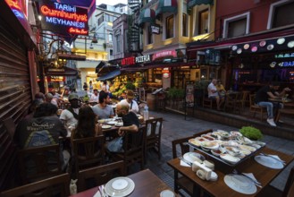 Istanbul, Turkey. July 17th 2023 Nightlife with bars and diners eating at restaurants in Balik