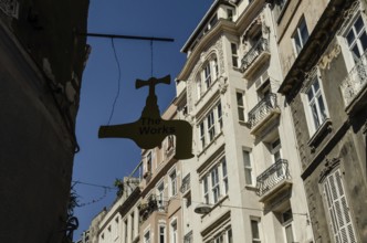 Istanbul, Turkey. 14th May 2015 The Works Antique shop sign hangs in front of typical European