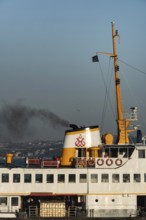 Istanbul, Turkey January 5th 2022 A Turkish Bosporus passenger ferry pumping out think black smoke