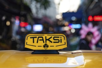 Istanbul, Turkey. November 10th 2022 An illuminated yellow Turkish taxi sign on a car parked in the