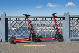 Istanbul, Turkey. October 5th 2021 Environmentally friendly red electric scooters parked on the