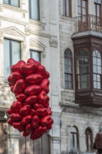 Istanbul, Turkey. November 29th 2020 Red heart shaped Valentines balloons hanging for sale in the