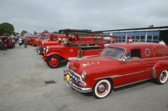Veteran fire trucks in a row, closest to the fire chief's car, Chevrolet built in 1952 at fire