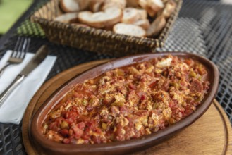 Istanbul, Turkey. August 3rd 2021 Turkish breakfast dish of Menemen with Eggs, Cheese, Tomatoes,