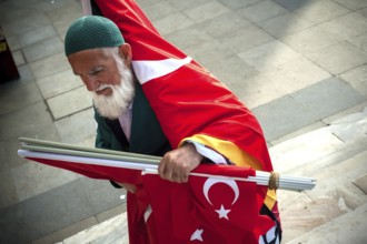 Istanbul, Turkey. May 6th 2016 A bearded Turkish man selling flags on the streets of Istanbul,