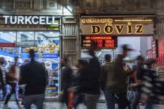 Istanbul, Turkey. October 5th 2021 Blurred people moving in front of a currency exchange office on