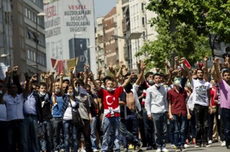 Istanbul, Turkey. June 1st 2013 Turkish protestors confront police with hand gestures during the