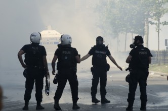 Istanbul, Turkey. June 1st 2013 Turkish riot police in clouds of tear gas, Gezi park, Taksim