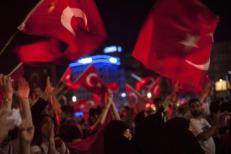 Istanbul, Turkey. July 19th 2016 Turkish pro government supporters in Taksim square waving flags