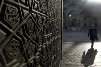 Istanbul, Turkey. January 11th 2010 A Turkish man leaves the Blue Mosque early in the morning,