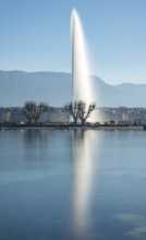 A tranquil shot of Geneva's iconic Jet d'Eau fountain, majestically rising above Lake Geneva