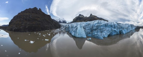 Panoramic view of Vatnajokull National Park's stunning ice formations, rugged mountains, and serene