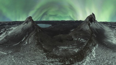 A breathtaking panorama of the Northern Lights dancing over two snow-dusted peaks in the Icelandic
