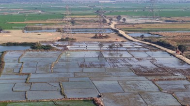 In an aerial view, cultivated rice paddy fields stand on display on February 16, 2026 in Mayong,
