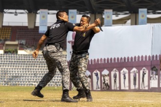 Personnel of the Central Reserve Police Force demonstrate close-combat training techniques during a
